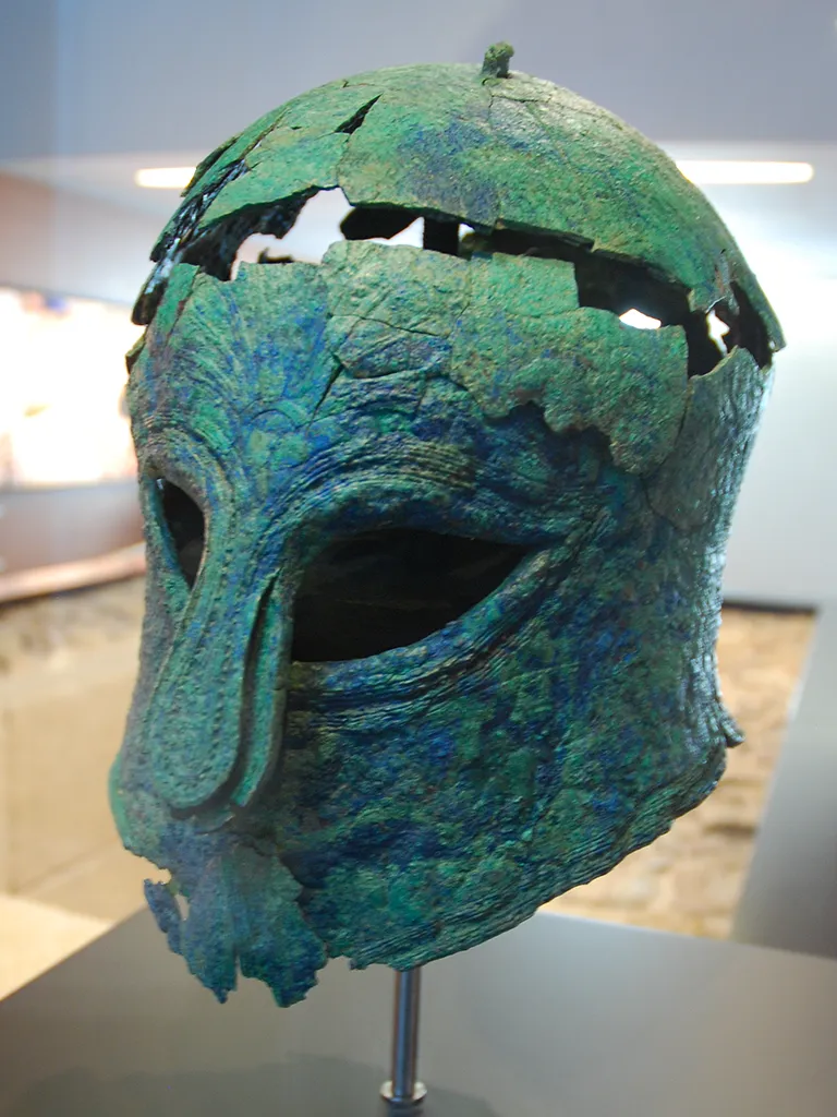 The Giglio Shipwreck: A 6th Century BC Etruscan Merchant Vessel Corinthian helmet - same age - Malaga museum